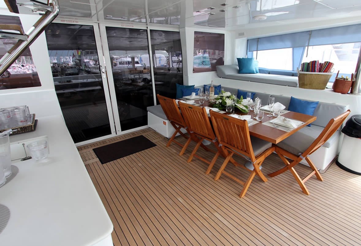 Spacious flybridge lounge aboard the Lagoon 620 charter catamaran