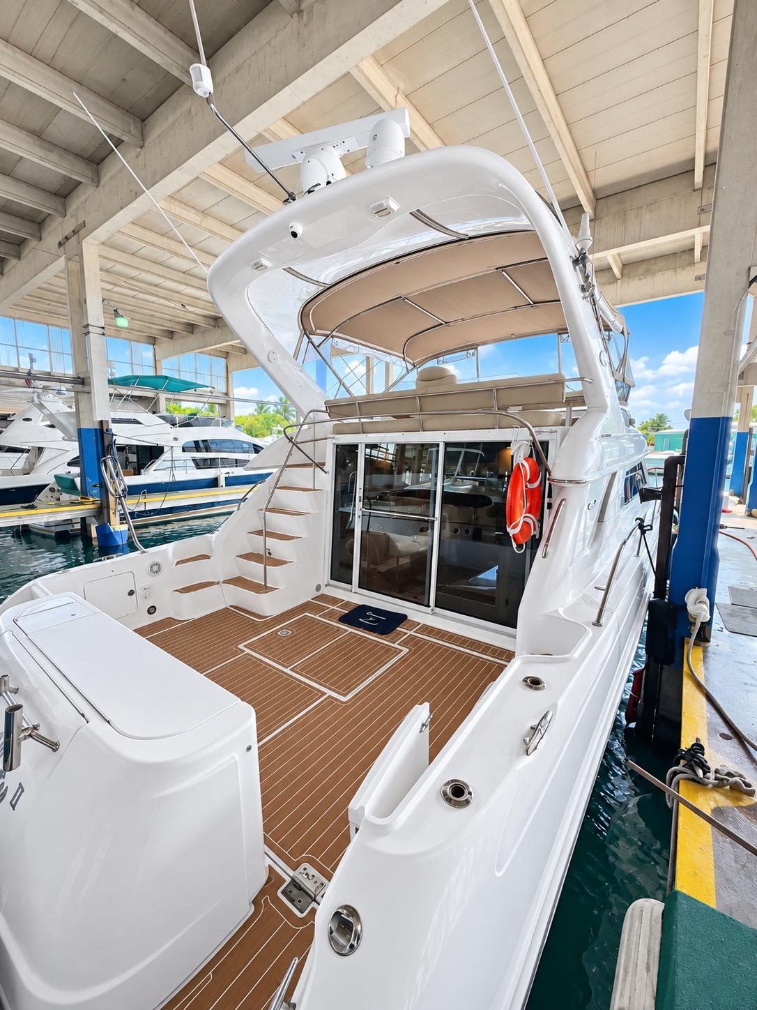 YOLO8 50 ft flybridge yacht available for private yacht charters in Miami, Florida, cruising Biscayne Bay.