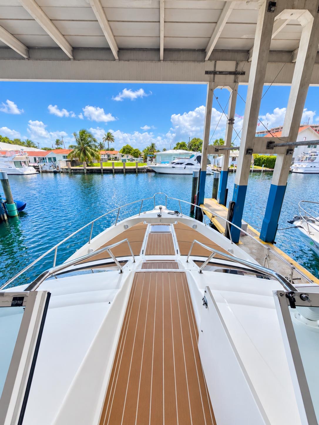 YOLO8 50 ft flybridge yacht available for private yacht charters in Miami, Florida, cruising Biscayne Bay.